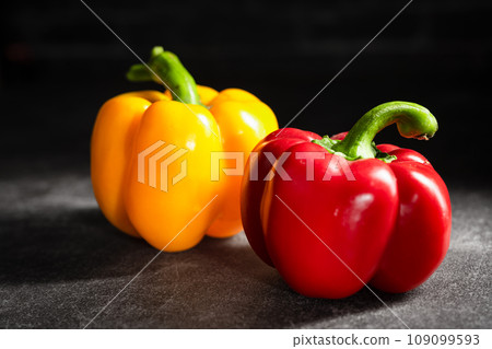 peppers on the dark background peppers on the dark background 109099593