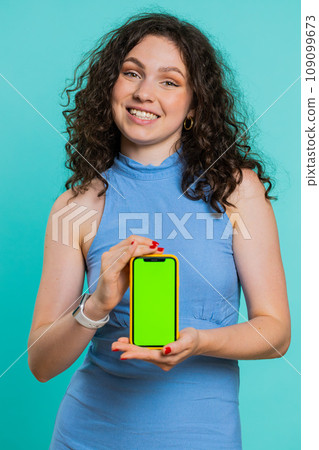 Developer woman girl hold smartphone with green screen chroma key mock up recommend good application 109099673