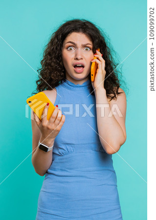 Irritated stressed business woman talking on two mobile phones having conversation conflict quarrel Irritated stressed business woman talking on two mobile phones having conversation conflict quarrel 109099702