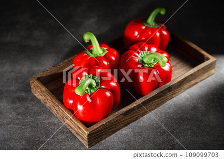 red peppers in wooden box red peppers in wooden box 109099703