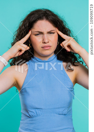 Young woman rubbing temples to cure headache problem, suffering from tension and migaine stress pain 109099719