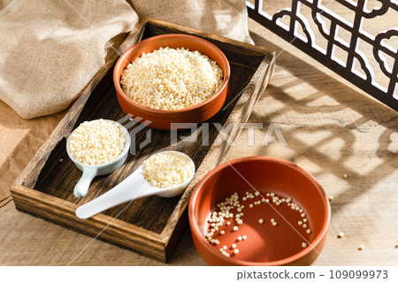 Sorghum rice on wood 109099973
