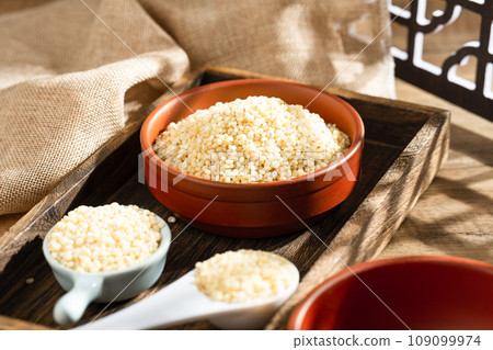 Sorghum rice on wood 109099974