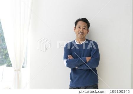 A man in his mid-50s smiling at the camera 109100345