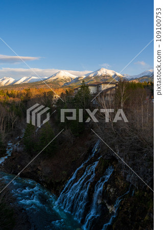 Spectacular views of Shirahige Falls, which divides into threads, and views towards Mt. Biei and Biei Fuji | Biei River | Shirokane, Biei-cho, Hokkaido Spectacular views of Shirahige Falls, which divides into threads, and views towards Mt. Biei and Biei Fuji | Biei River | Shirokane, Biei-cho, Hokkaido 109100753