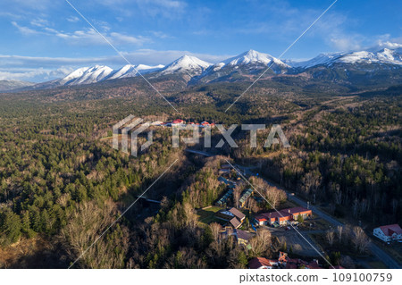Drone photography | Aerial photography of refreshing blue skies and snow-capped Mt. Biei, Biei Fuji, and Mt. Tokachi | Biei Town, Hokkaido Drone photography | Aerial photography of refreshing blue skies and snow-capped Mt. Biei, Biei Fuji, and Mt. Tokachi | Biei Town, Hokkaido 109100759