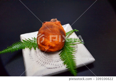 Dried persimmons on a plate during the New Year Dried persimmons on a plate during the New Year 109100822