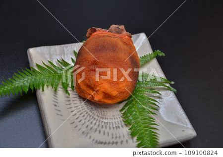 Dried persimmons on a plate during the New Year Dried persimmons on a plate during the New Year 109100824
