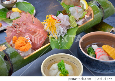 Uchiwa shrimp sashimi and vinegared whale meat served in a bamboo bowl Uchiwa shrimp sashimi and vinegared whale meat served in a bamboo bowl 109101466