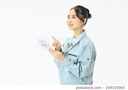 Woman dressed in work clothes Woman dressed in work clothes 109103063