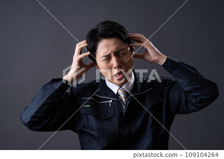 Middle-aged man in work clothes 109104264