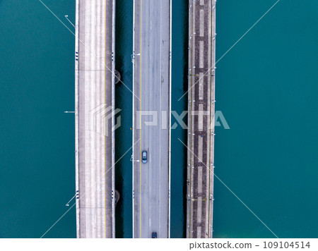 Aerial top view drone shot of bridge with cars on bridge road image transportation background concept,Aerial view of sarasin bridge in Phuket Thailand transportation background,Top view 109104514