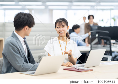 Young male and female engineers having a meeting in the office Young male and female engineers having a meeting in the office 109106643