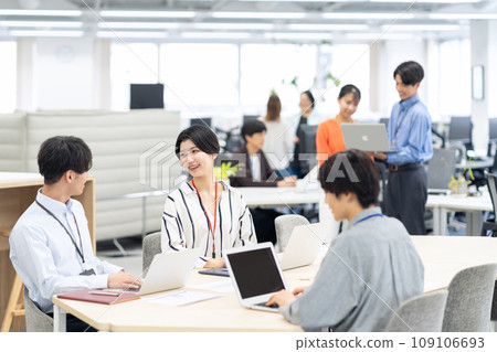 Young male and female engineers having a meeting in the office 109106693