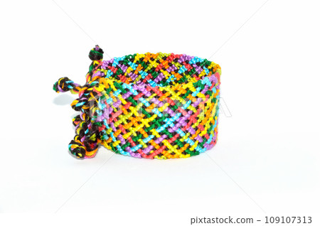 DIY woven tied friendship bracelet with unusual braiding. Summer accessory DIY woven tied friendship bracelet with unusual braiding. Summer accessory 109107313