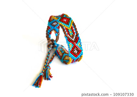 DIY woven tied friendship bracelet with unusual braiding. Summer accessory DIY woven tied friendship bracelet with unusual braiding. Summer accessory 109107330