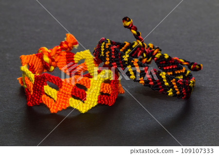 DIY woven tied friendship bracelet with unusual braiding. Summer accessory 109107333
