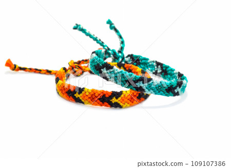 DIY woven tied friendship bracelet with unusual braiding. Summer accessory DIY woven tied friendship bracelet with unusual braiding. Summer accessory 109107386