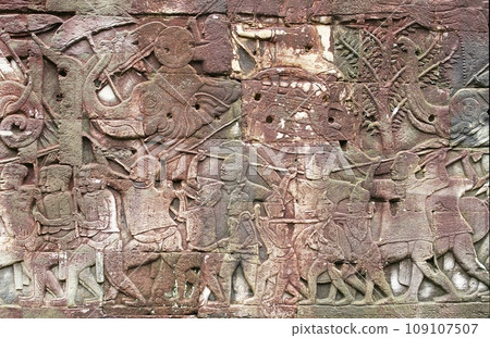 Angkor Wat, a world heritage site, has a relief of the king of Angkor Thom riding an elephant. 109107507