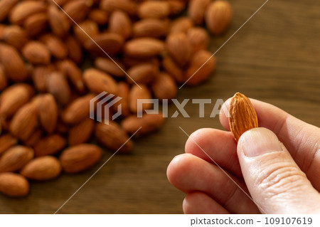 pick up a grain of almond pick up a grain of almond 109107619