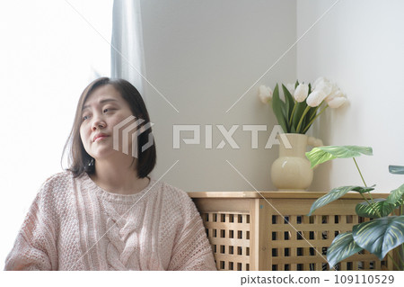 asian woman read book and relax at home asian woman read book and relax at home 109110529