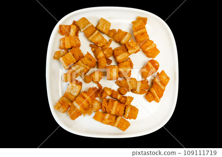 Top view of Crispy Pork on black background. 109111719