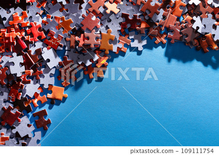 Colorful Jigsaw Puzzle on Blue Background Colorful Jigsaw Puzzle on Blue Background 109111754