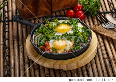 Shakshuka roasted egg in the pan with tomato 109112787