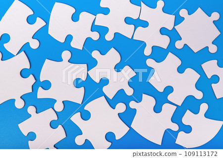 Scattered puzzle pieces, jigsaw elements in chaos, mess Scattered puzzle pieces, jigsaw elements in chaos, mess 109113172