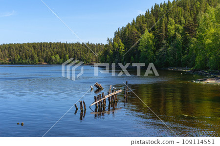 The remains of the old pier on the island of Valaam on Lake Ladoga 109114551