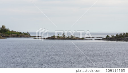 Small rocky islands overgrown with trees on Lake Ladoga 109114565