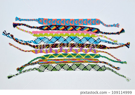 DIY woven friendship bracelets with different braiding. Summer accessory DIY woven friendship bracelets with different braiding. Summer accessory 109114999