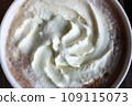 Closeup top view hot mocha fresh coffee with whipping cream in a white cup . Drink concept. 109115073
