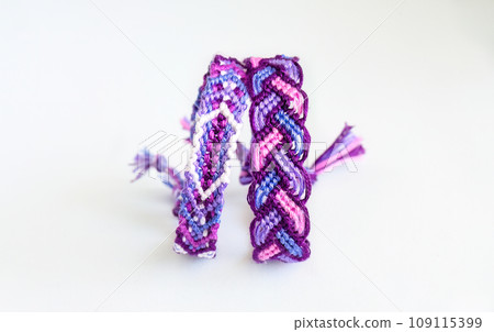 DIY woven friendship bracelets with different braiding. Summer accessory DIY woven friendship bracelets with different braiding. Summer accessory 109115399