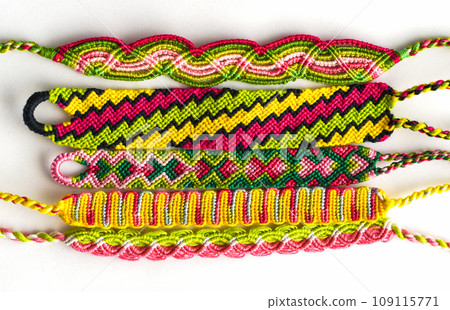 DIY woven friendship bracelets with different braiding. Summer accessory DIY woven friendship bracelets with different braiding. Summer accessory 109115771