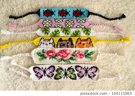 DIY woven friendship bracelets with different braiding. Summer accessory 109115965