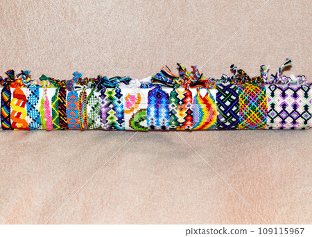 DIY woven friendship bracelets with different braiding. Summer accessory 109115967
