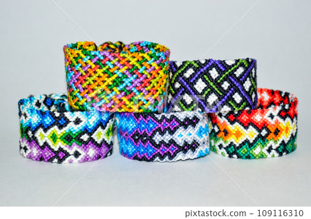 DIY woven friendship bracelets with different braiding. Summer accessory 109116310