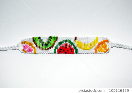 DIY woven friendship bracelets with different braiding. Summer accessory 109116329