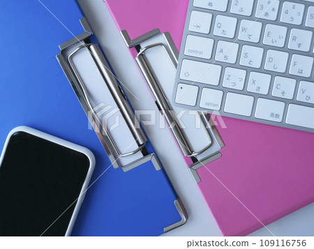 Binders, keyboards and smartphones on the table Binders, keyboards and smartphones on the table 109116756