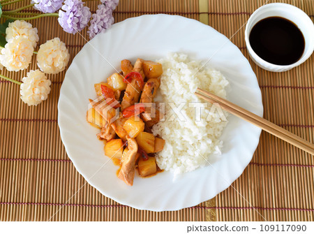 Chicken in sweet and sour sauce with pineapple, paprika and rice. asian cuisine 109117090