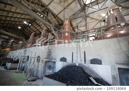 Nikka Whiskey Yoichi Distillery’s pot still and coal-fired kiln Nikka Whiskey Yoichi Distillery’s pot still and coal-fired kiln 109118069