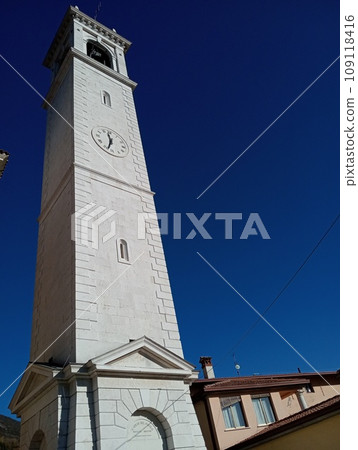 ancient bell tower of the church of Botticino morning in Brescia in Italy on a beautiful sunny day with blue sky 109118416
