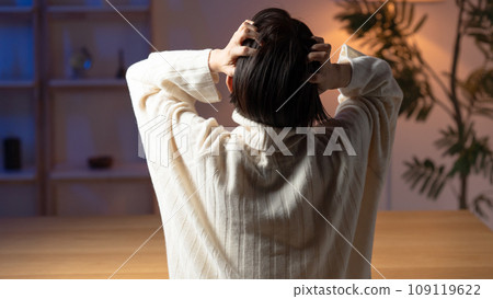 A woman holding a head A woman holding a head 109119622