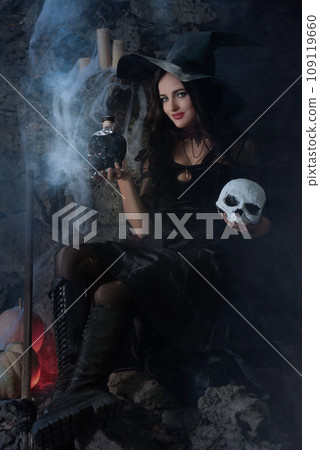 A portrait of a young sexy witch with outside. Magic, dark force, spell. Witchcraft. Halloween. A portrait of a young sexy witch with outside. Magic, dark force, spell. Witchcraft. Halloween. 109119660