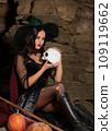 A portrait of a young sexy witch with outside. Magic, dark force, spell. Witchcraft. Halloween. 109119662