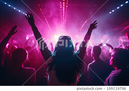 Large group of young people are dancing in a nightclub. Large group of young people are dancing in a nightclub. 109119706