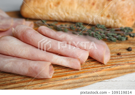 Tasty ham on white wooden table, closeup 109119814