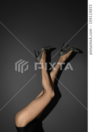 Woman wearing tights and stylish shoes on black background, closeup of legs Woman wearing tights and stylish shoes on black background, closeup of legs 109119855
