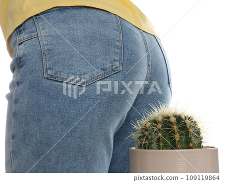 Woman sitting down on cactus against white background, closeup. Hemorrhoid concept Woman sitting down on cactus against white background, closeup. Hemorrhoid concept 109119864
